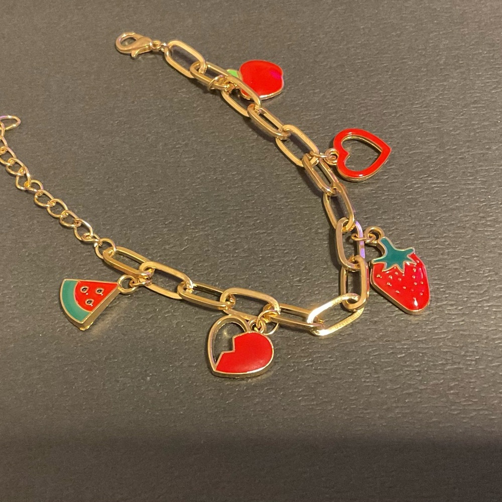 Custom-made charm bracelet with whimsical fruit and heart